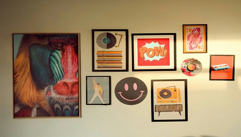 Gallery wall of framed posters and art prints, a category among etsy top selling items.