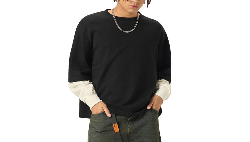 Layered Long Sleeve Oversized Tee in black with cream sleeves, channeling 1990s fashion silhouettes