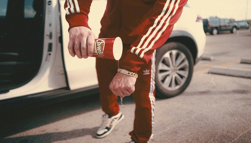Red Adidas tracksuit and sneakers, classic 70s fashion ideas still in rotation today