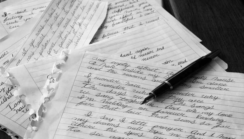 Handwritten correspondence representing newsletter ghostwriting, one of the highest-paying side hustles that make $2000 a month
