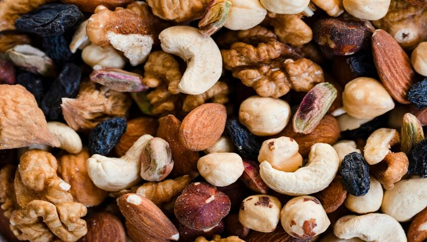 Close-up of GORP trail mix with nuts and raisins, the snack behind what is gorpcore.