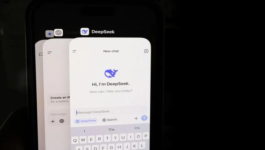 Smartphone showing ChatGPT and DeepSeek AI chat apps, the tools behind how to make money with AI.