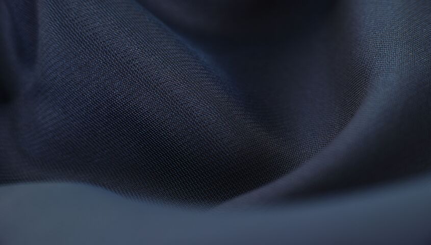 Close-up of polyester fabric showing what polyester is made of at the fiber level