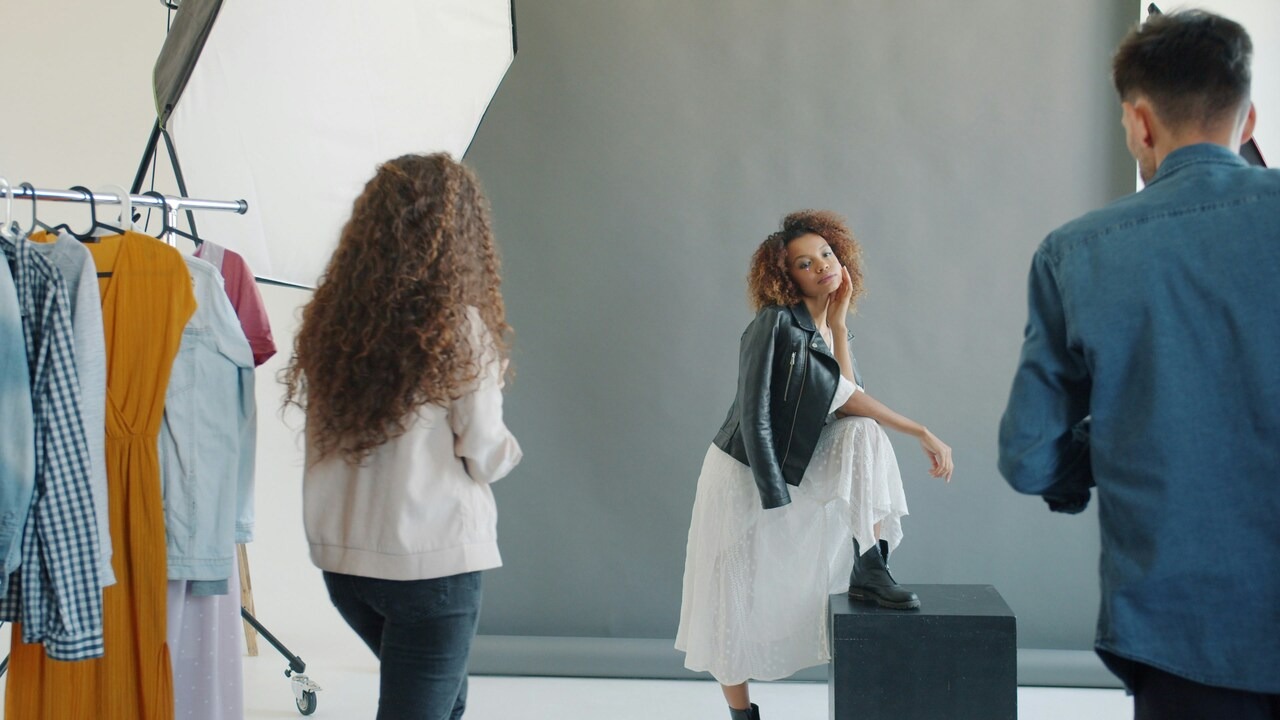 Photo studio shoot with a model in a leather jacket and skirt, showing how real-people photography helps grow ecommerce sales in fashion.