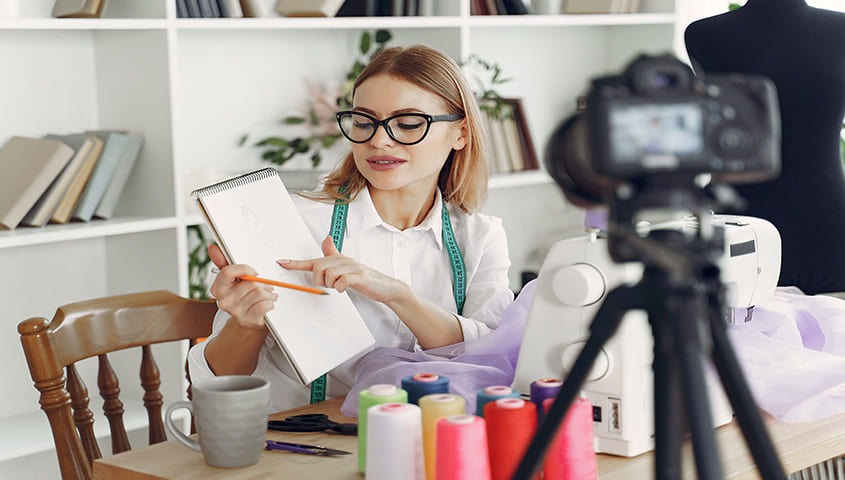 Woman vlogging at home to start affiliate marketing make money