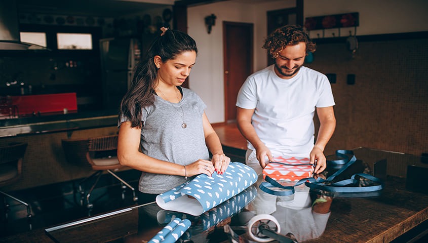 Two person are make personliazed gifts