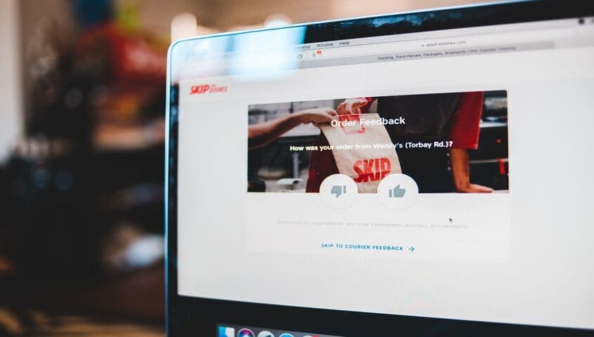 The laptop shows order feedback as a ecommerce growth strategy