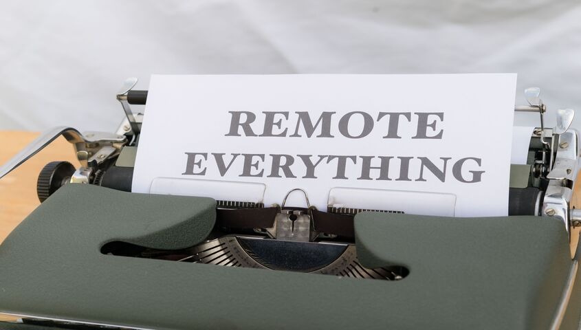 Vintage typewriter with a page reading "Remote Everything," representing the remote-service side of low cost business ideas for 2026.