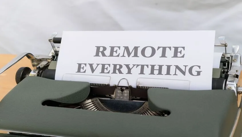 Vintage typewriter with a page reading "Remote Everything," representing the remote-service side of low cost business ideas for 2026.