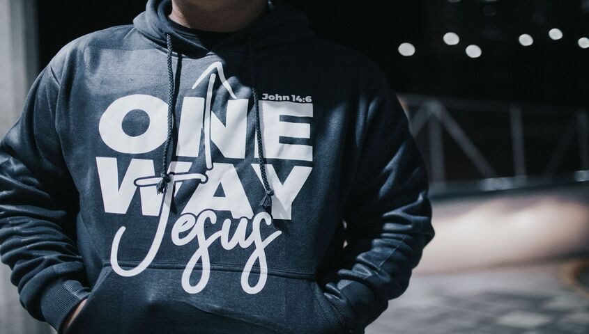 Close-up of a custom printed hoodie with bold typography, one of the highest-margin businesses to start with no money.