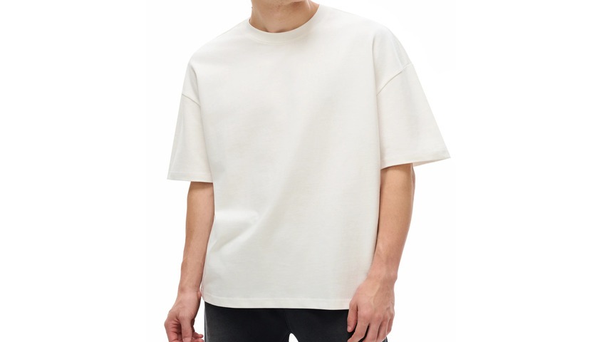 Model in a heavyweight boxy tee, the structured silhouette that defines high quality t shirts.