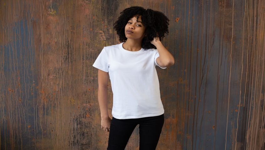 White crew-neck tee on a model, the smooth-canvas standard for high quality custom t shirts.