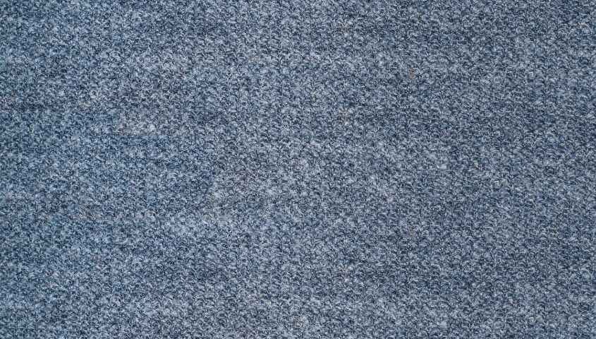 Close-up of a textured blue fabric surface