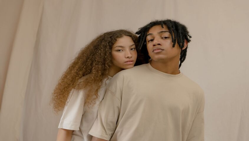 Two models in matching cream tees, the starting point for any average t shirt weight comparison.