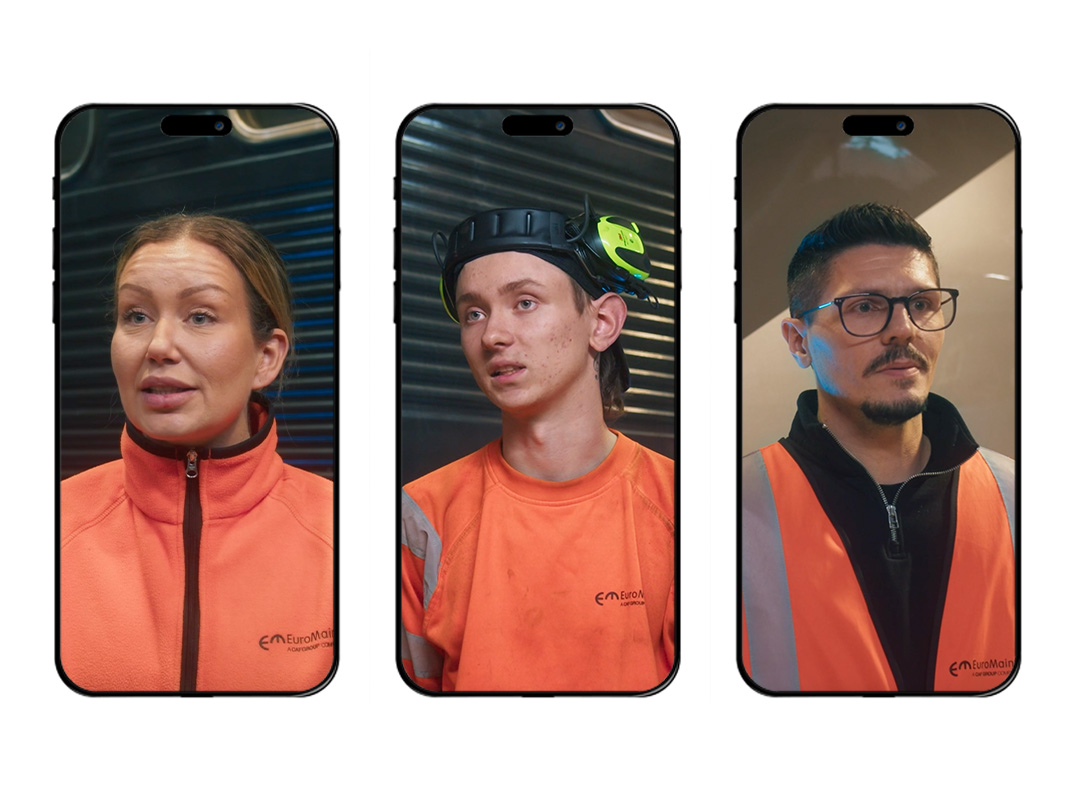 Tre personer klädda i orange EuroMaint arbetskläder visas på enskilda mobilskärmar; en kvinna till vänster, en ung man i mitten med hörselskydd på huvudet, och en man med glasögon och reflexväst till höger.