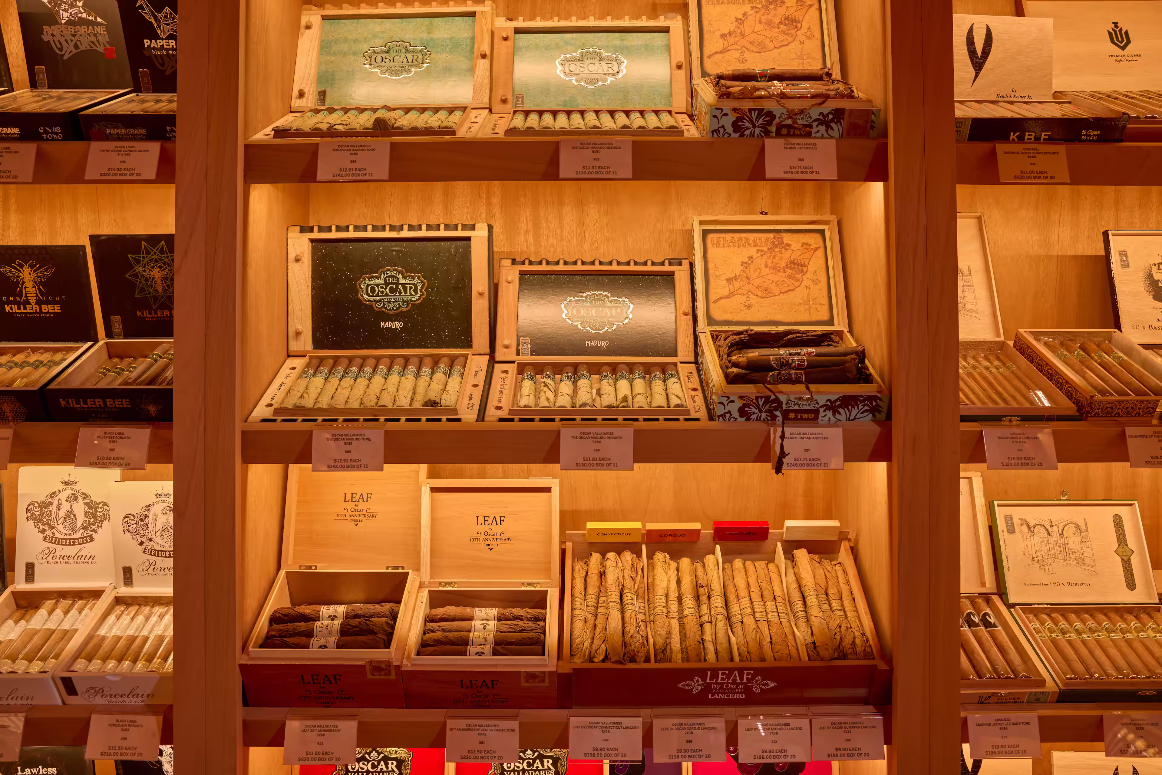 The Drawing Room's expansive cigar selection warmly lit. Photo by Adam Milliron