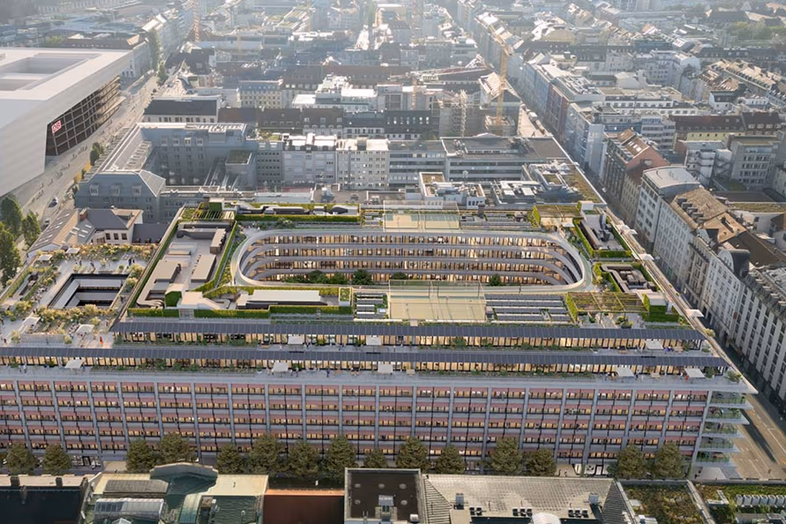 Luftaufnahme des geplanten Mixed-Use-Quartiers THE VERSE im Herzen von München mit großzügigen Dachgärten und modernem Gebäudekomplex.