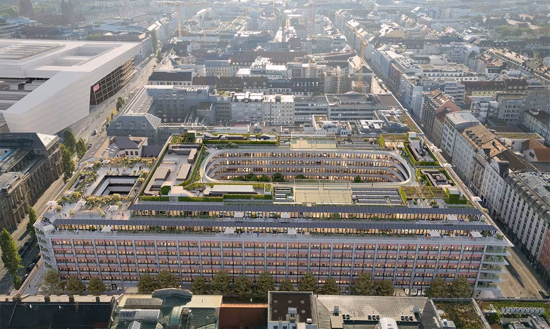 Luftaufnahme des geplanten Mixed-Use-Quartiers THE VERSE im Herzen von München mit großzügigen Dachgärten und modernem Gebäudekomplex.