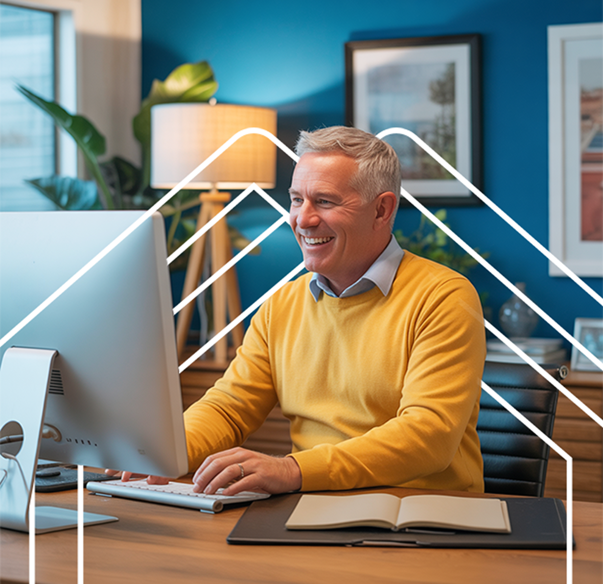 man smiling at computer