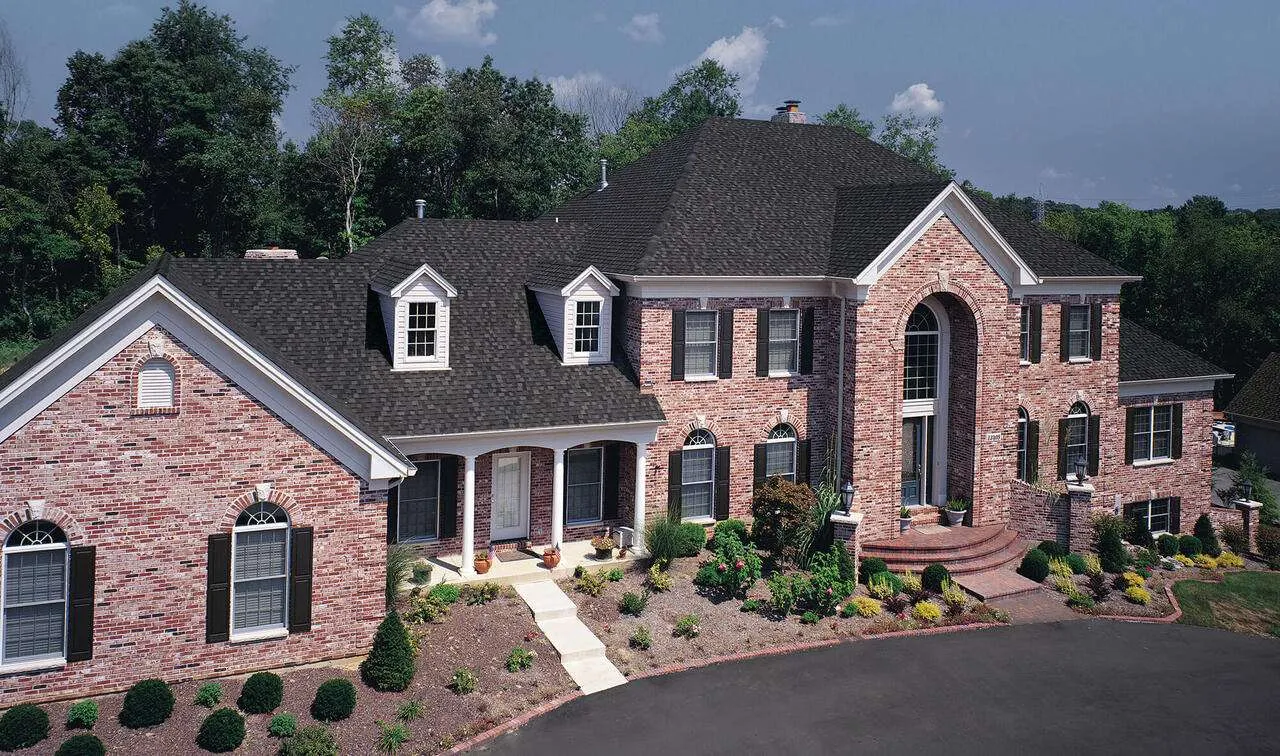 TAMKO Storm Fighter Flex Class 4 shingles installed on brick mansion