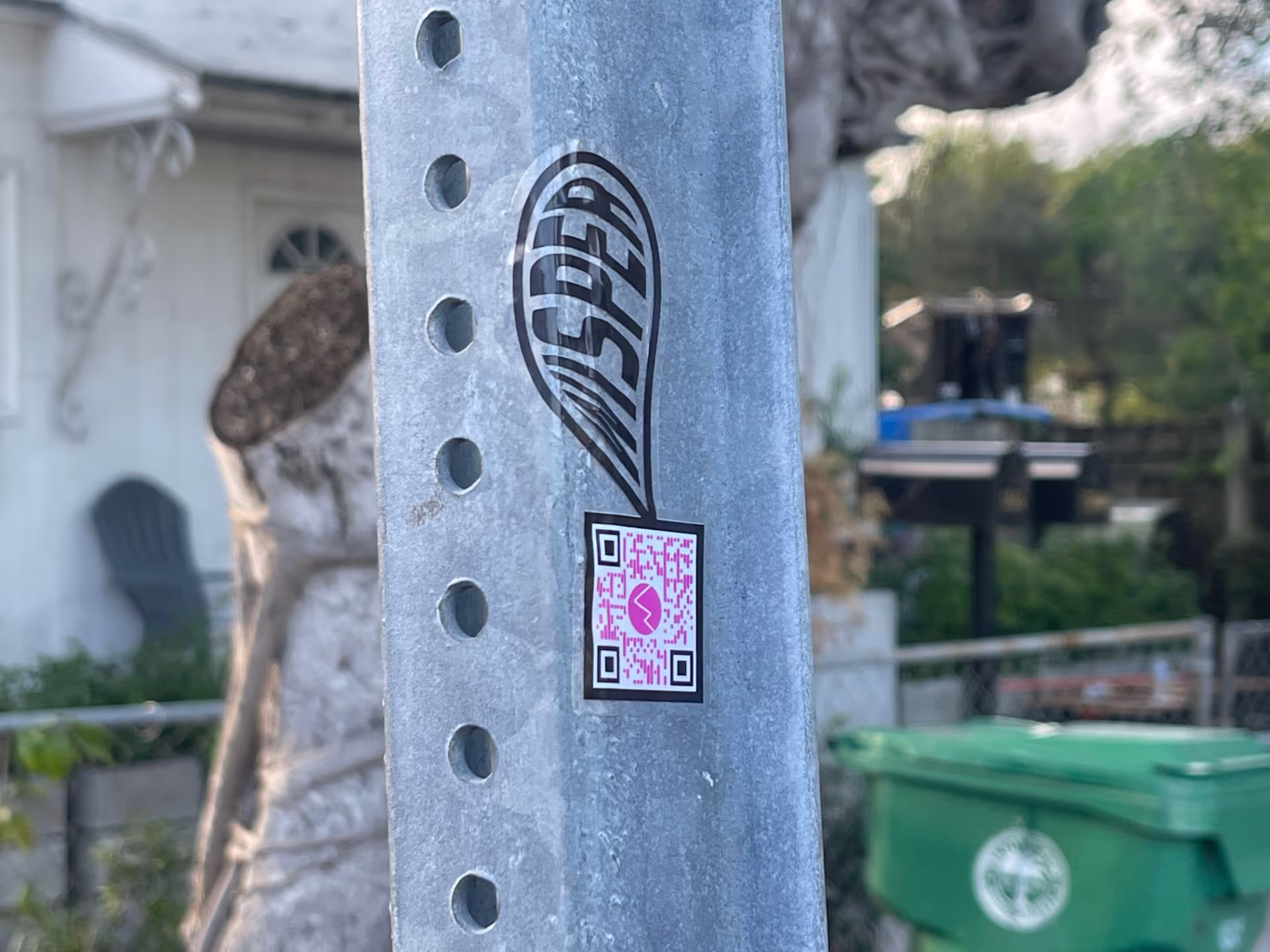 MUD Foundation WISper, featuring a close-up of a perforated metal post with a black WISPER sticker and QR code.