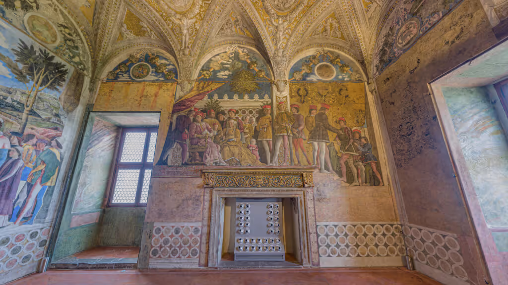 MUD Foundation Andrea Mantegna’s Camera Picta in Verse, featuring an ornate Renaissance room with frescoes depicting historical figures gathered around a throne, decorative patterns, window openings, and a central stone fireplace.