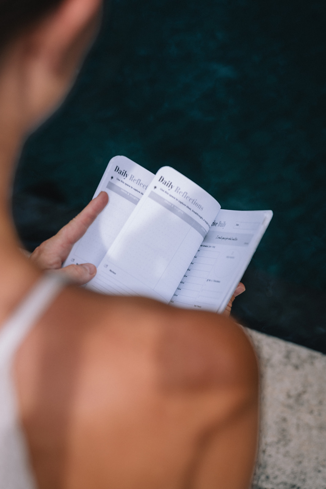 Woman writing her daily reflections during the retreat