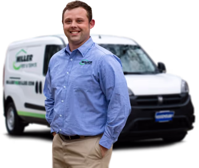 miller pest control technician in front of his truck