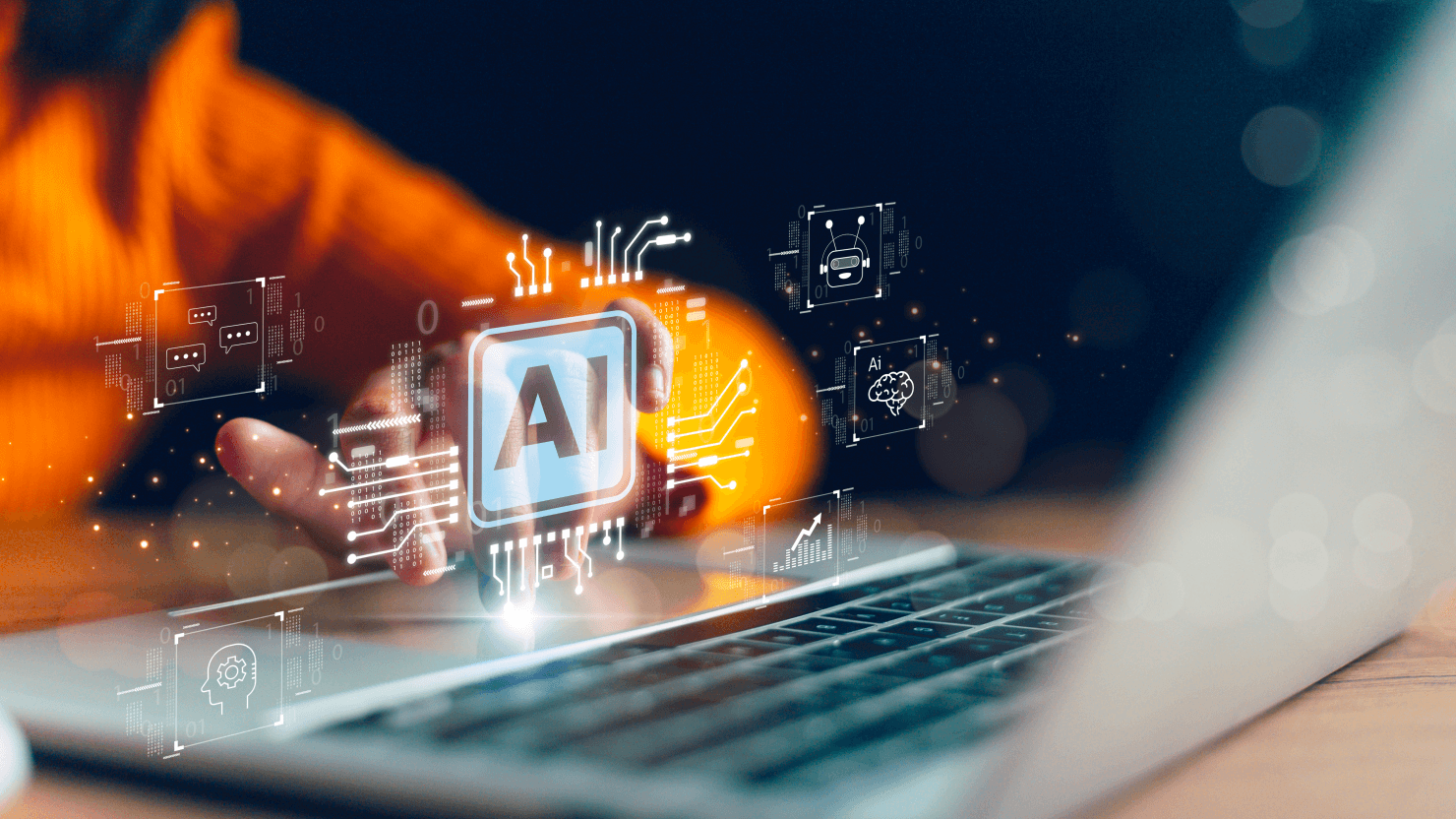 Programmer wearing OSH Cut orange hoodie using AI to vibe code an app