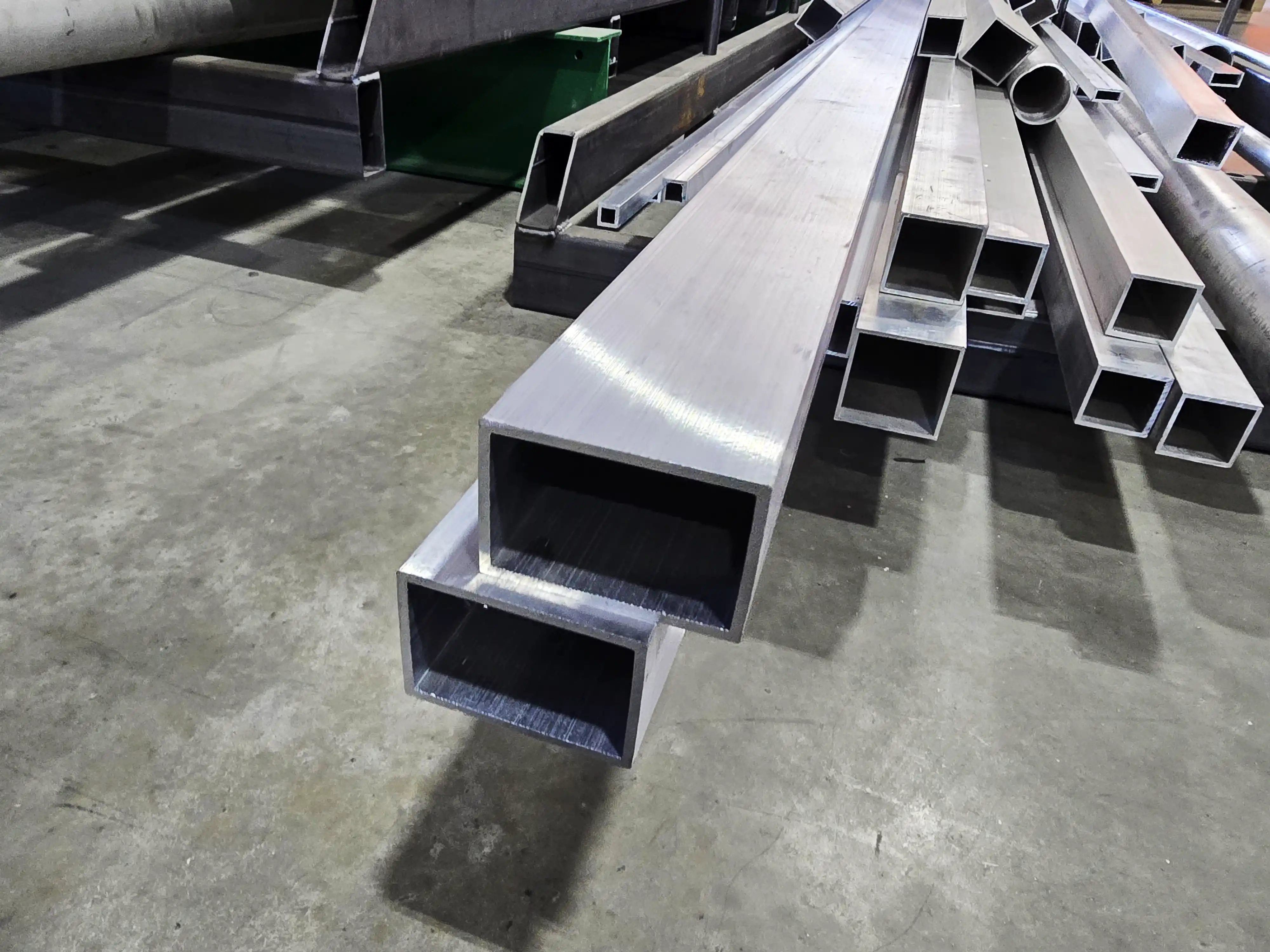 6063 aluminum rectangular tubes on a shop floor