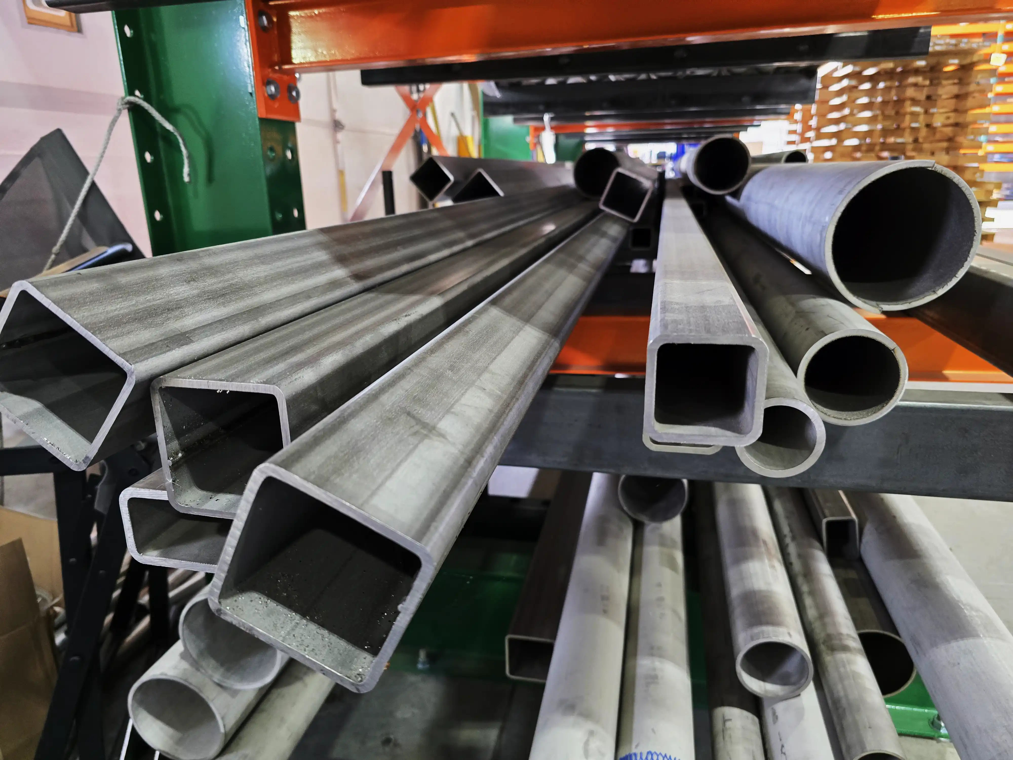 304 stainless steel round and square tubes on a rack