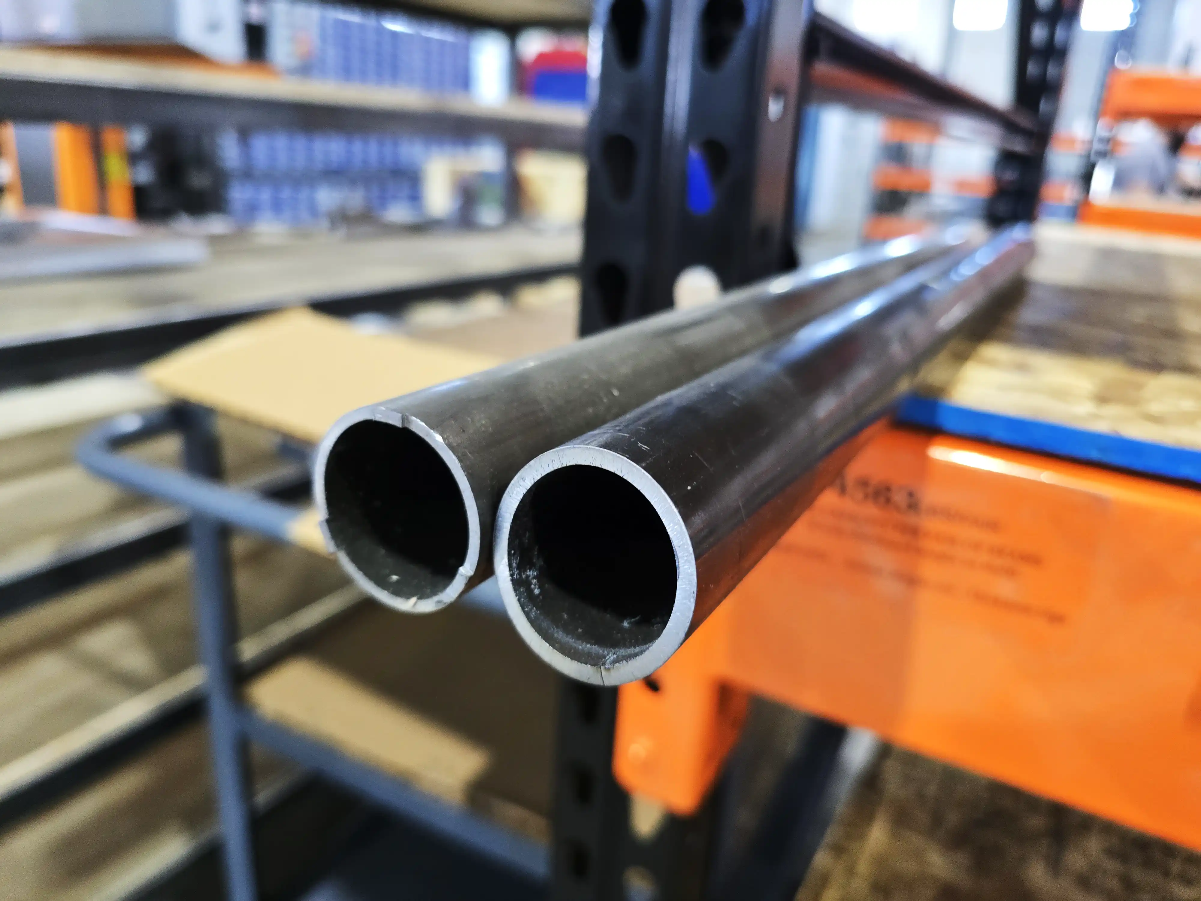 Two 1020 DOM steel tubes on a rack