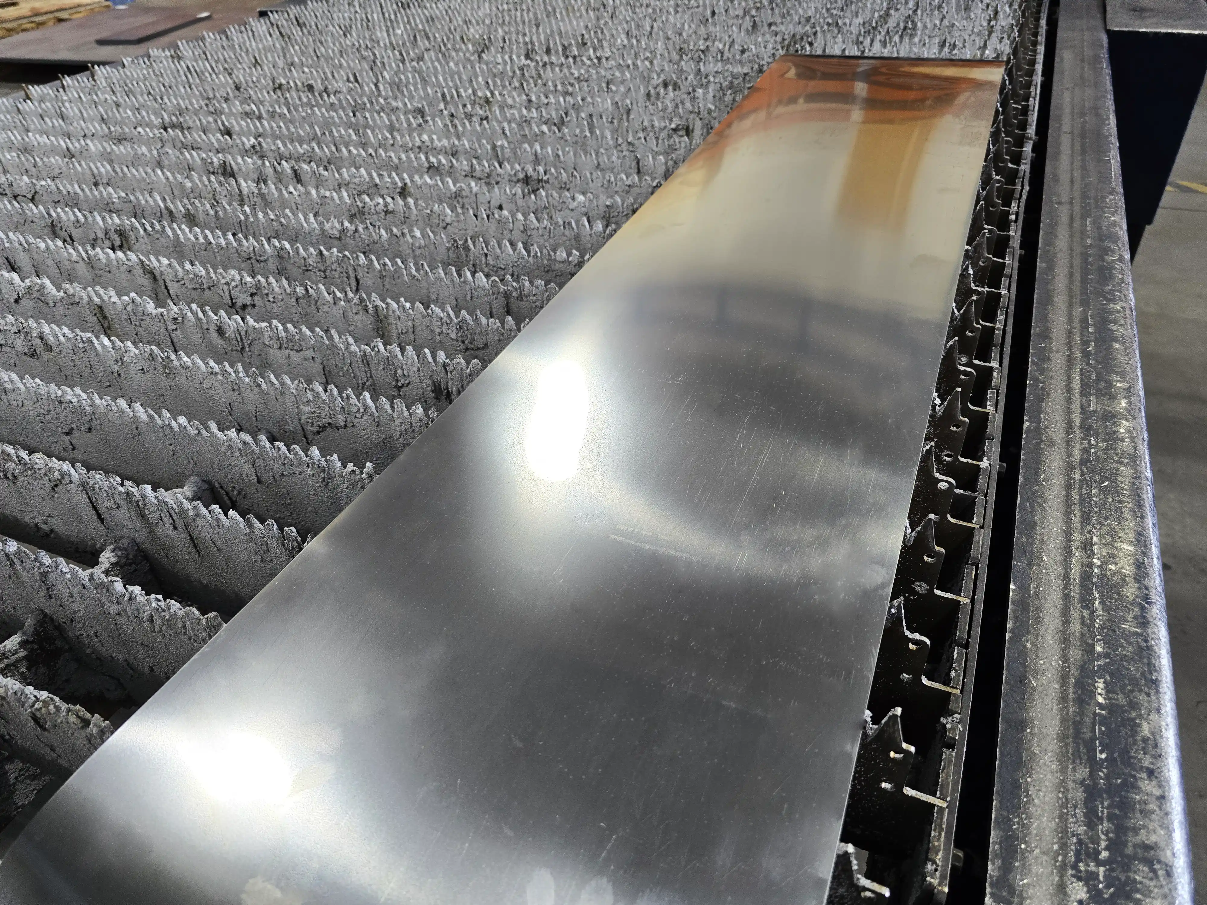 Thin 304 stainless shim stock on a laser cutting table