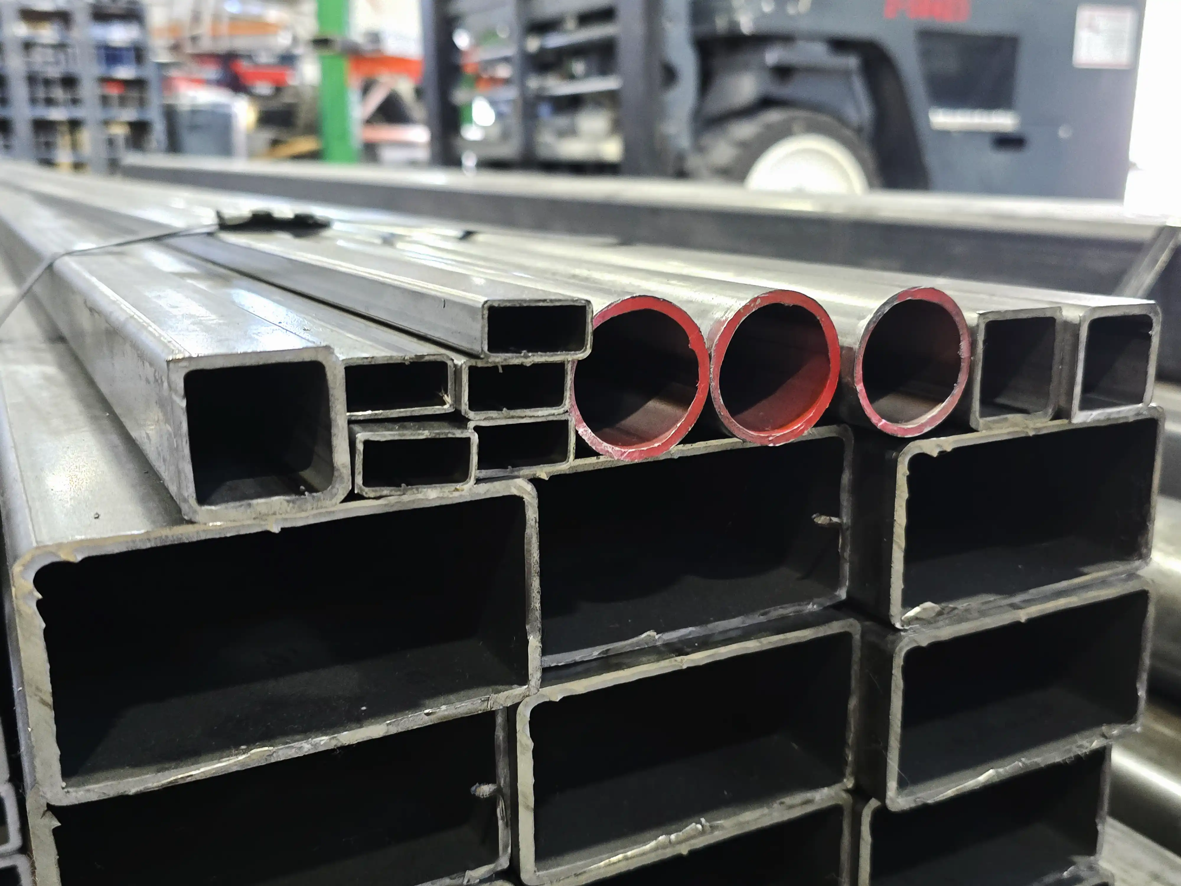 Stacked A513 steel rectangular, square, and round tubes