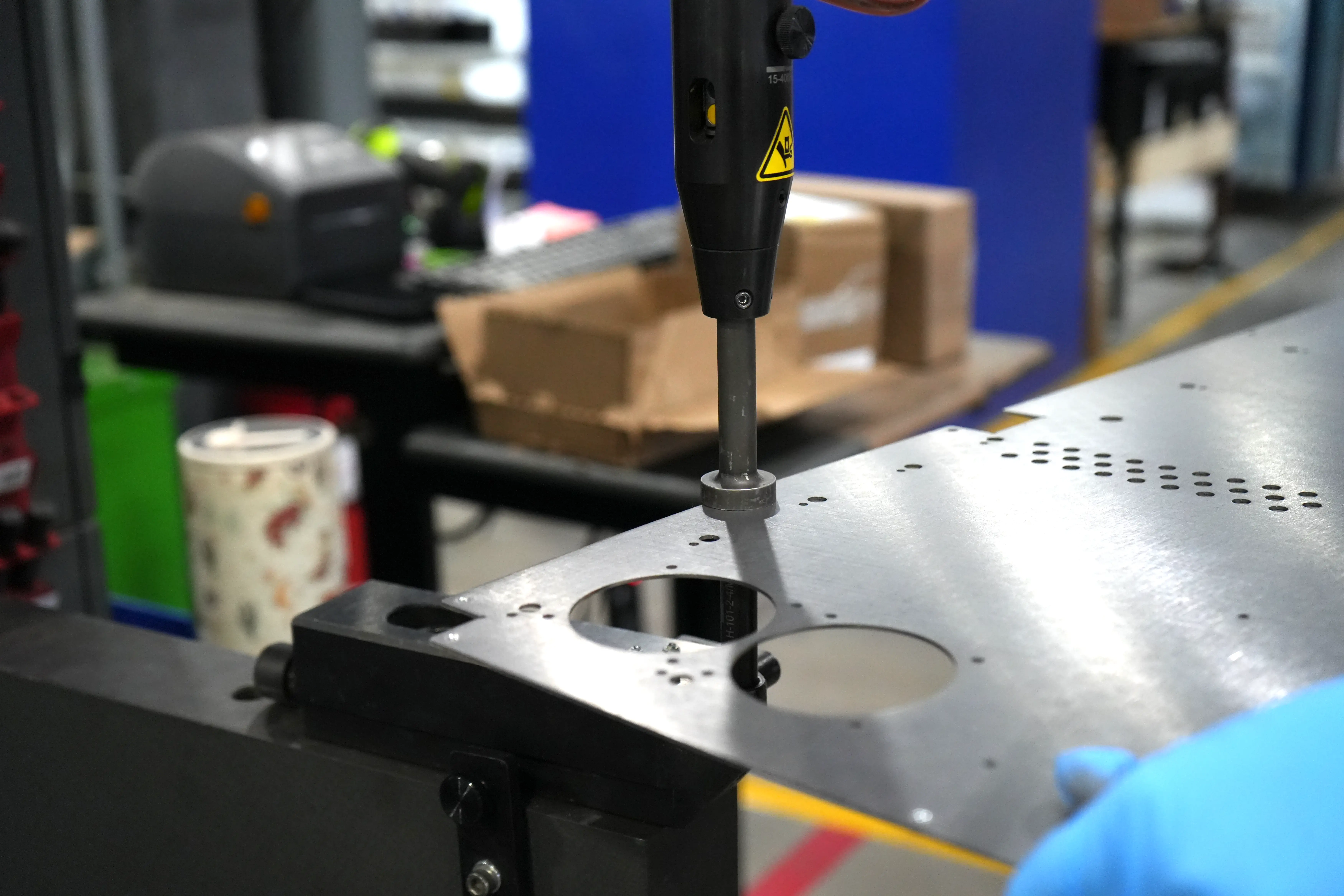 Hardware insertion press installing fasteners in a large sheet metal part