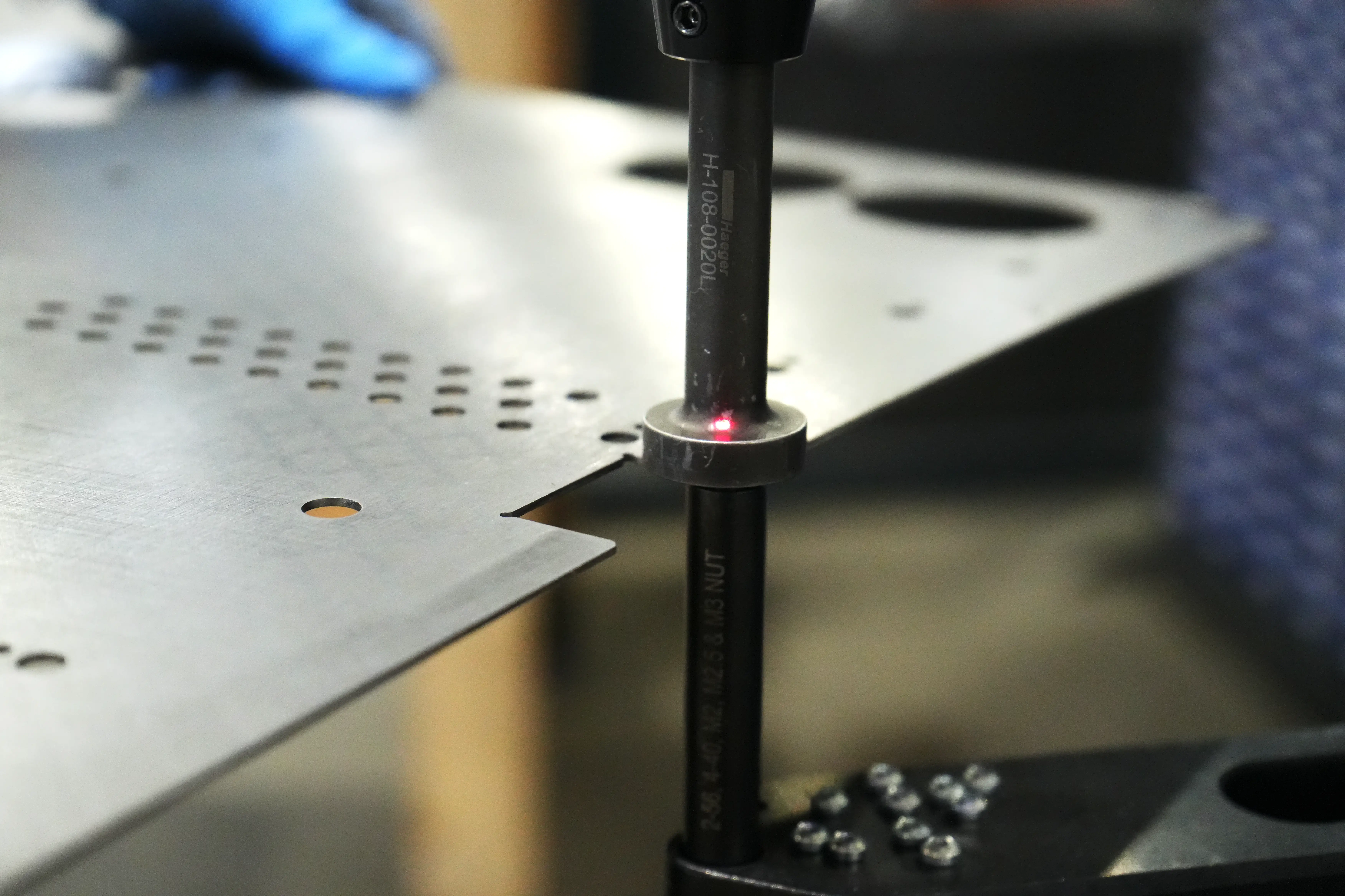 PEM fastener being pressed into a sheet metal part