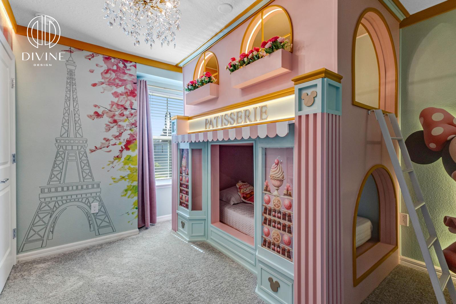 Colorful kids' bedroom with a Paris-themed wall and patisserie-style bunk bed playhouse.