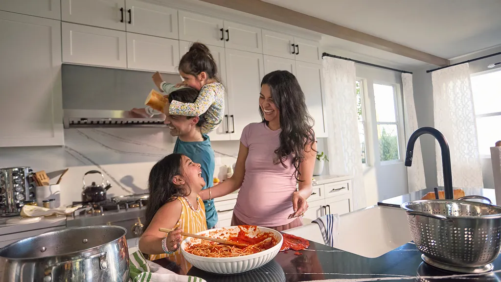 Family in cooking in kitchen