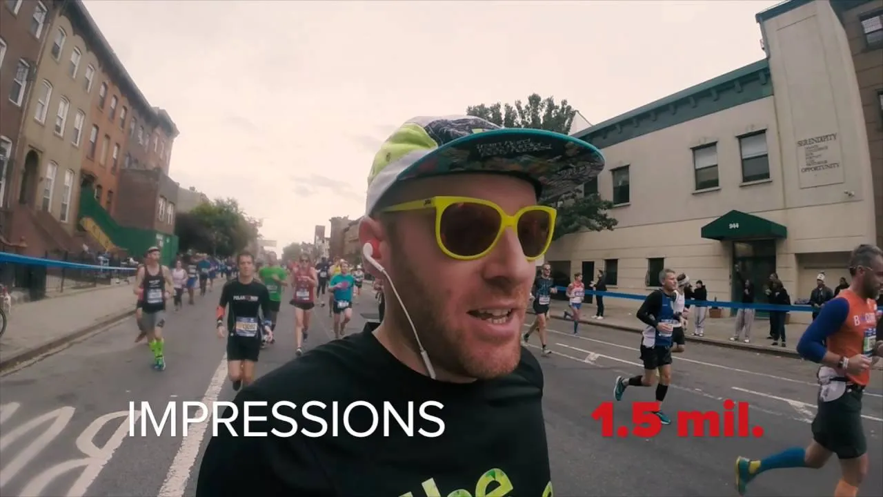 A smiling runner wearing sunglasses and earbuds looks at the camera mid-race, with a '1.5 mil. Impressions' performance stat overlaid on the image.