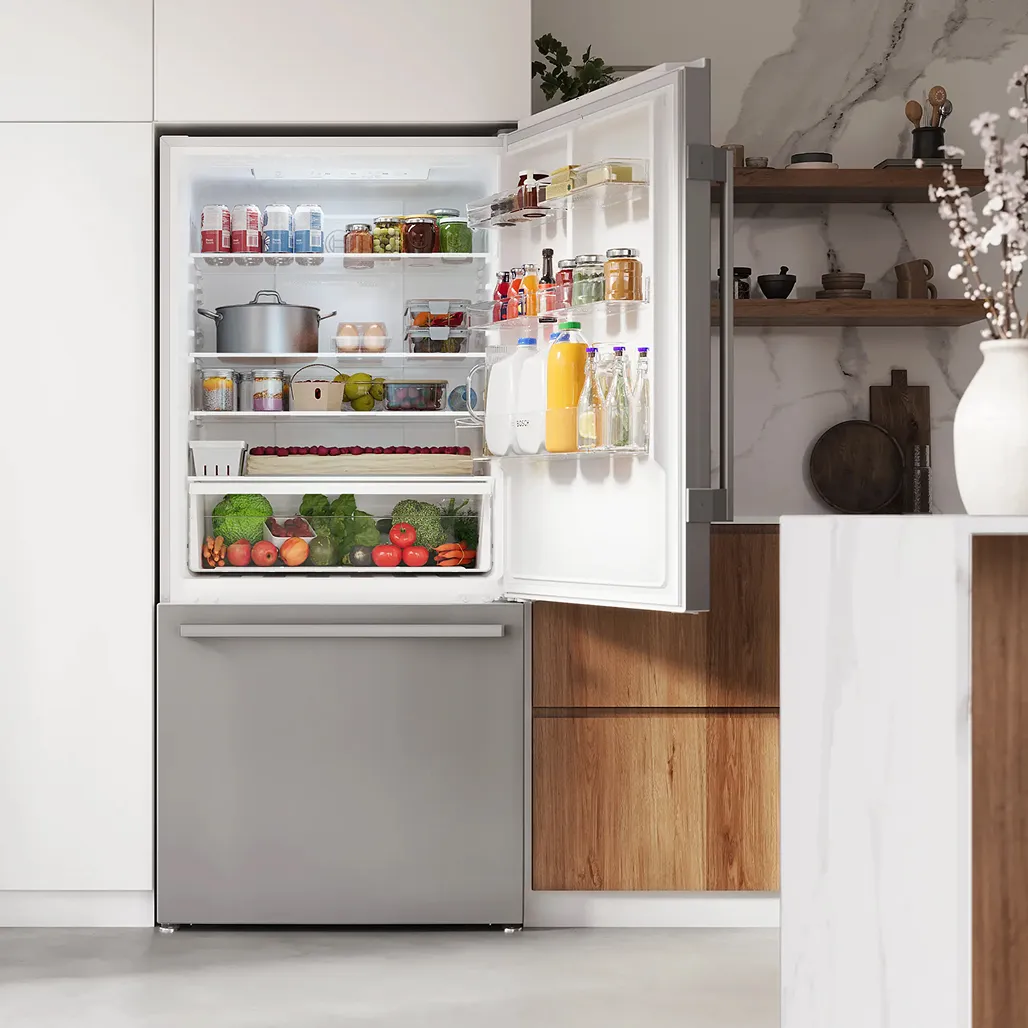 A bright all-white kitchen featuring Bosch stainless steel appliances including a French door refrigerator, wall ovens, and a range, with hardwood floors and a center island.