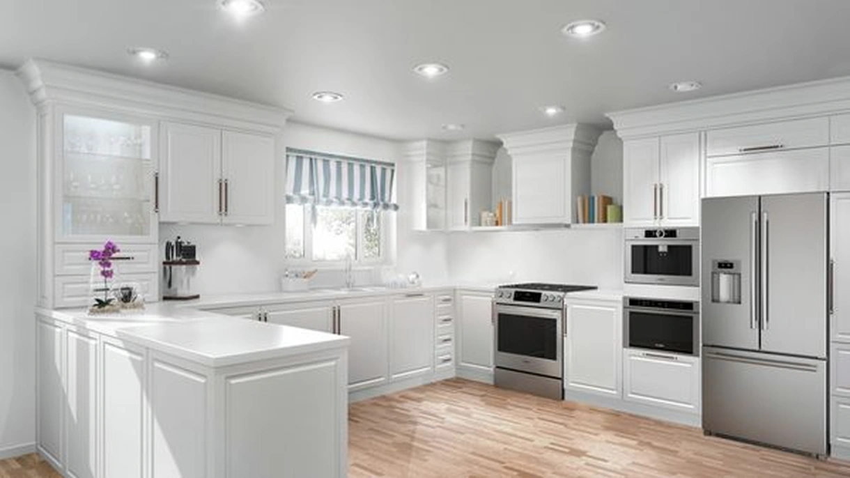 A bright all-white kitchen featuring Bosch stainless steel appliances including a French door refrigerator, wall ovens, and a range, with hardwood floors and a center island.