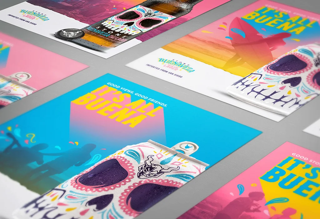 A flat lay of Stone Buenaveza "It's All Buena" campaign print ads and social assets featuring colorful Day of the Dead skull imagery and bold pink, blue, and yellow typography.