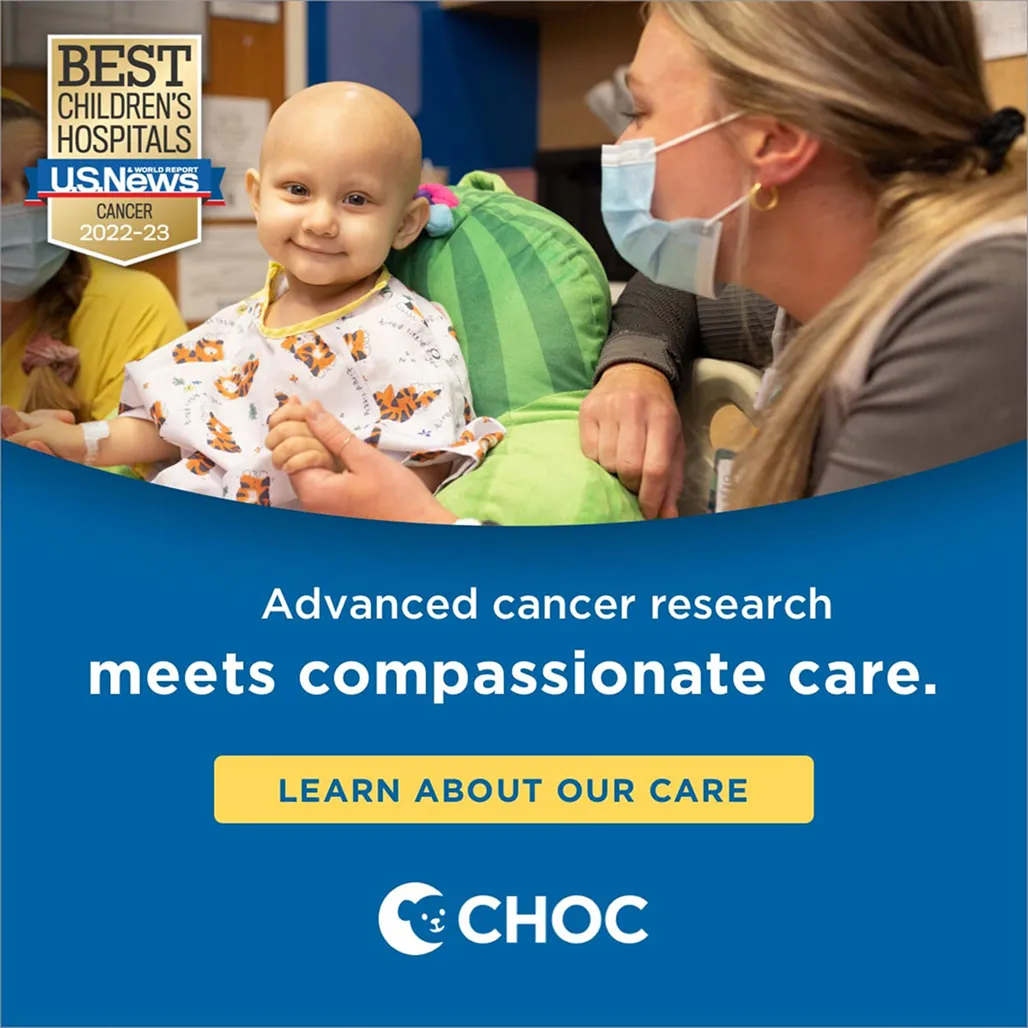 A young child in a hospital gown smiles while seated on a green cushion. A masked caregiver is close, exuding warmth. Text highlights CHOC’s cancer care and U.S. News recognition.