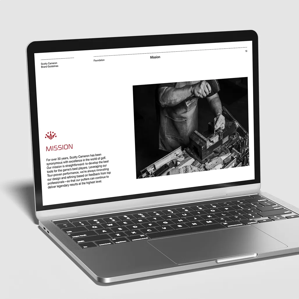 Laptop mockup displaying the Mission page of the Scotty Cameron Brand Guidelines with a craftsman stamping a putter.