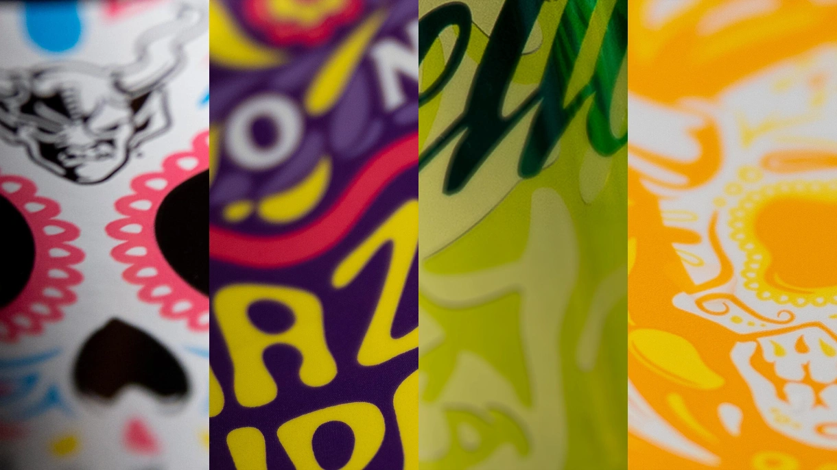 Close-up collage of four colorful Stone Brewing can designs, including the Buenaveza sugar skull and floral Hazy IPA artwork.