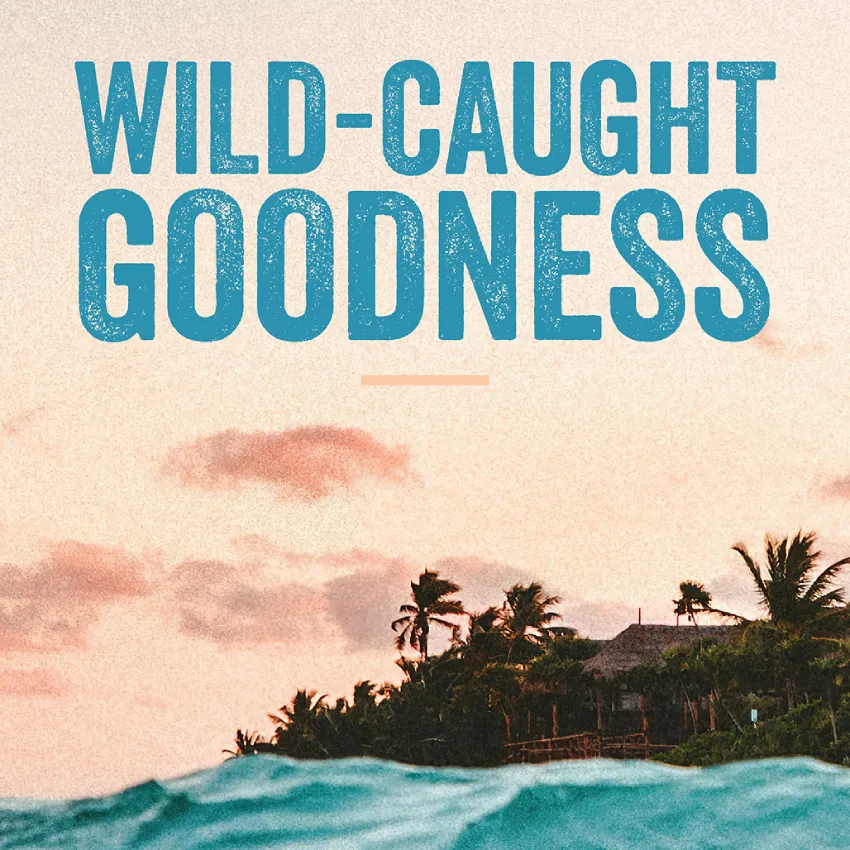 "Wild-Caught Goodness" headline over an ocean wave with a palm-covered island and pink sunset sky in the background.