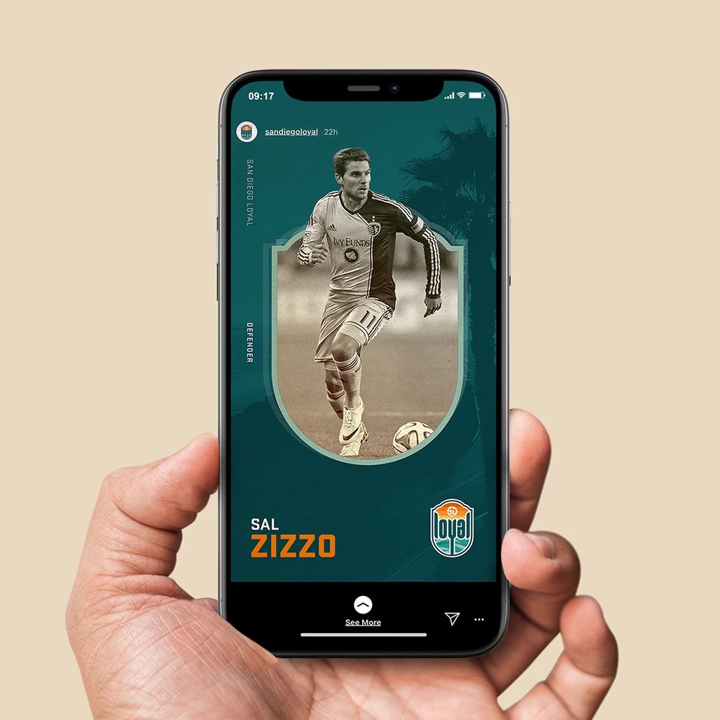  Hand holding phone displaying SD Loyal Instagram story featuring defender Sal Zizzo player card.