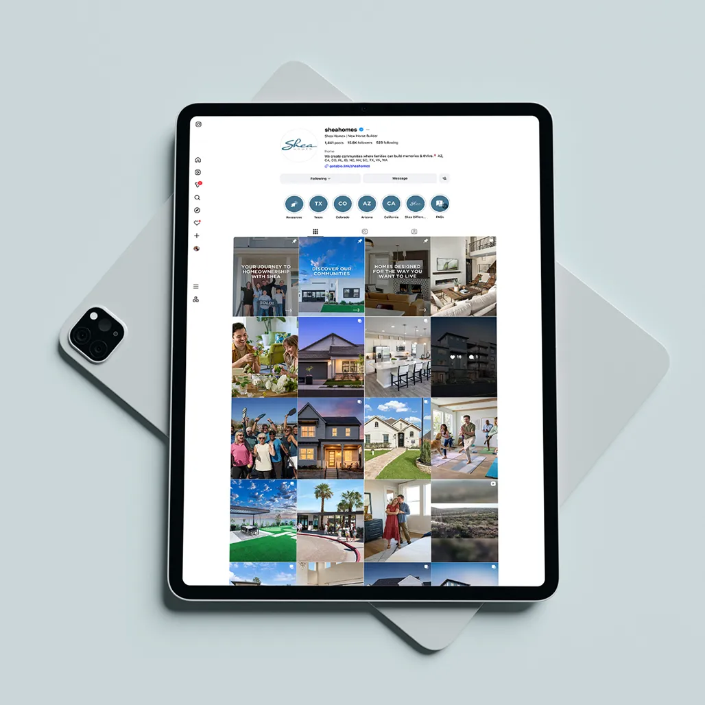 Tablet displaying a social media profile with a grid of photos showing houses, people, and gatherings, suggesting community and modern living.