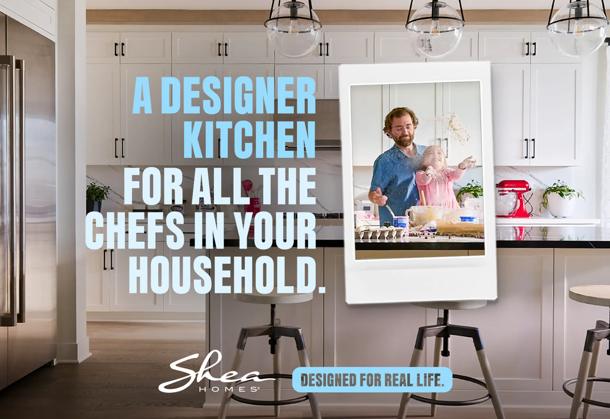 Designer kitchen ad with a playful father and child baking. Shea Homes logo, tagline: "Designed for Real Life."