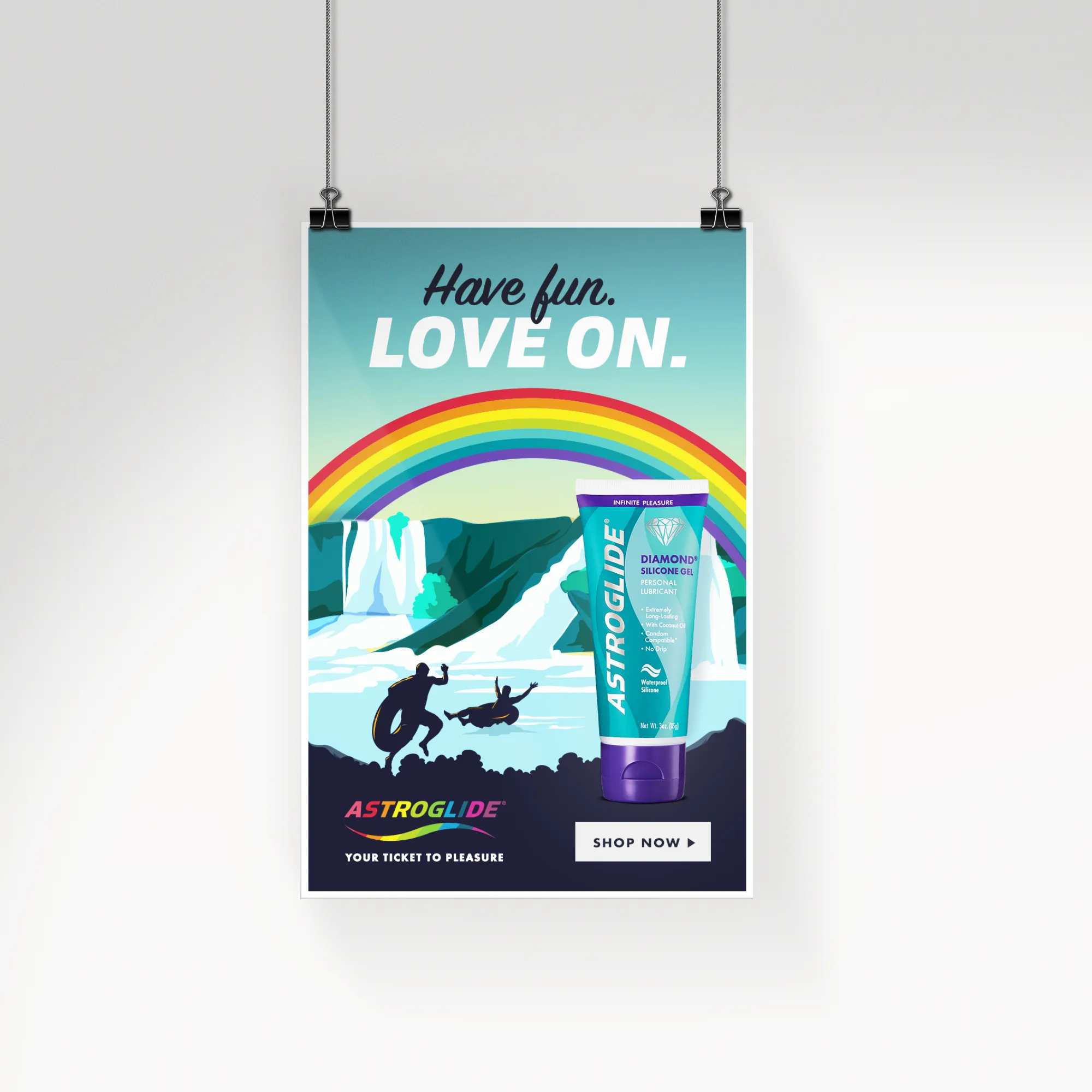 Astroglide "Have Fun. Love On." Pride poster with Diamond Silicone Gel and two men tubing near a waterfall under a rainbow